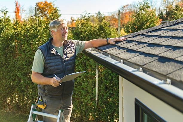 Professional Hail Damage Roof Repair technician working in Hollow Rock, TN